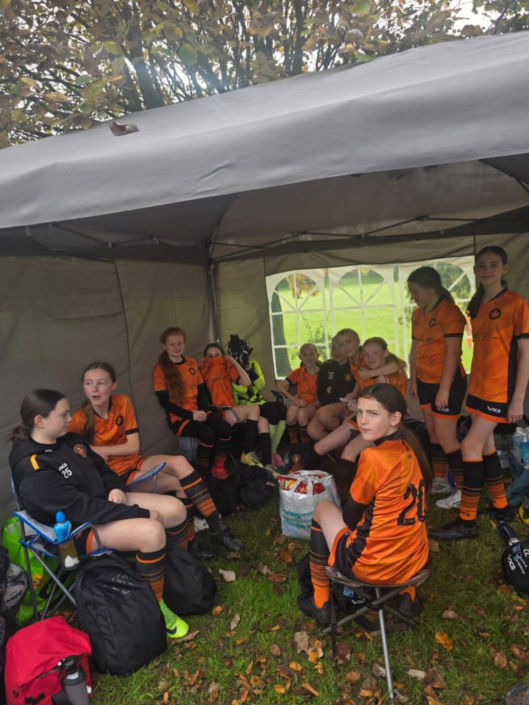 Gleniffer Thistle girls team talking to one another