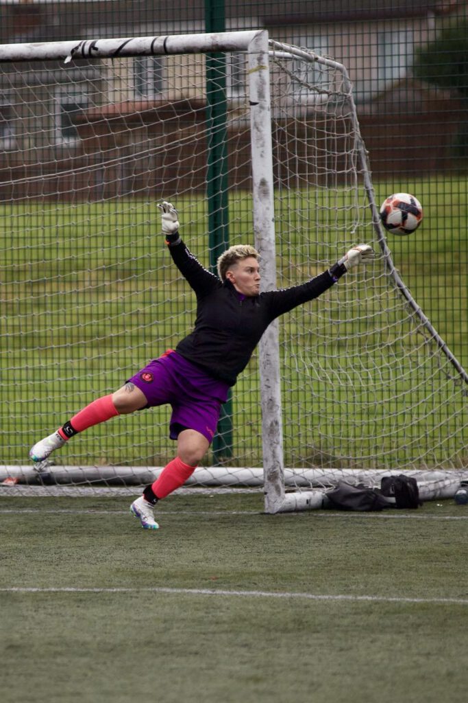 Goalkeeper saving a goal